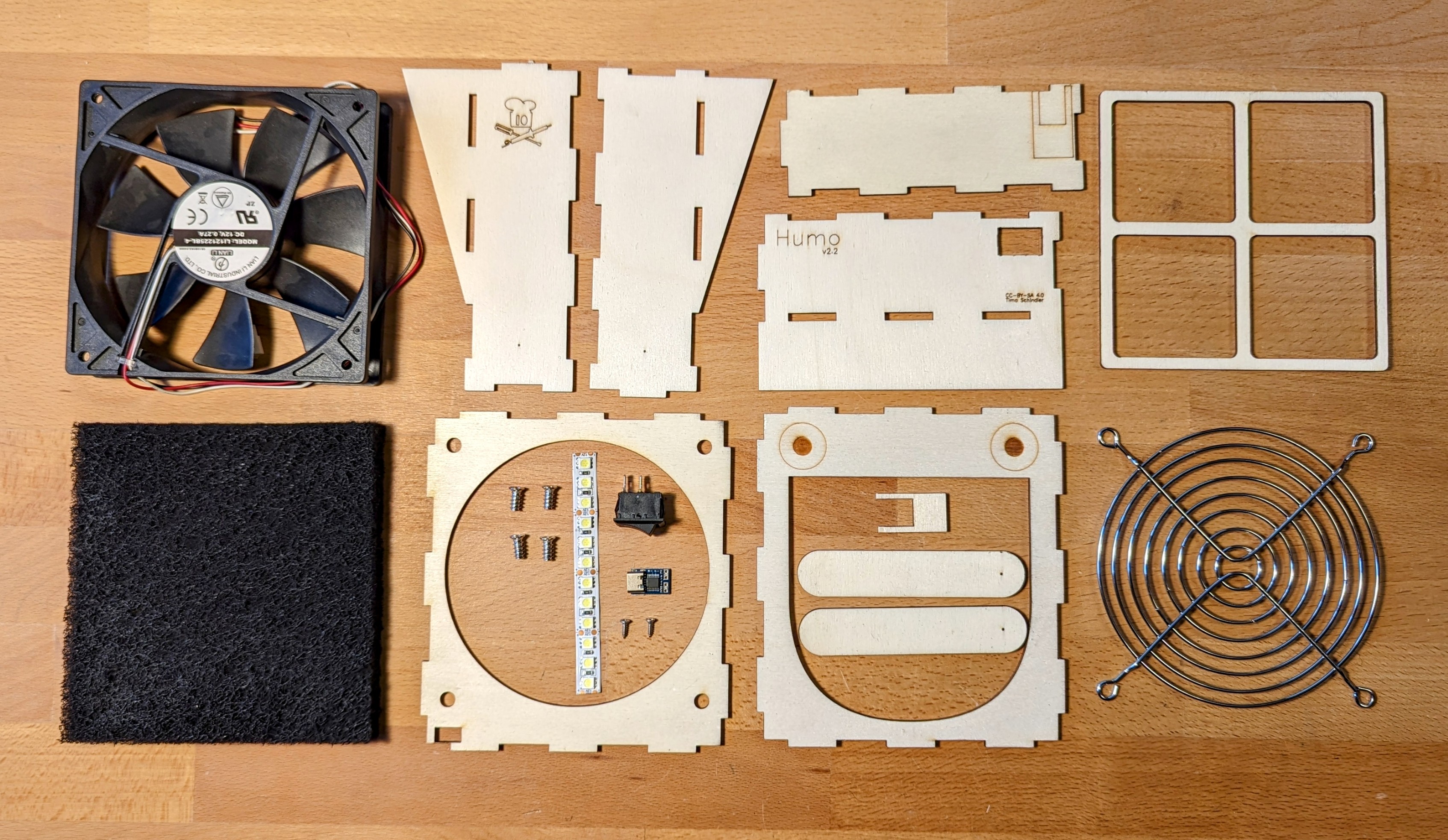 All Parts of the Humo Fume Extractor Kit at a Glance Overview of all components of the Humo DIY kit including fan, wood case, and LED strip