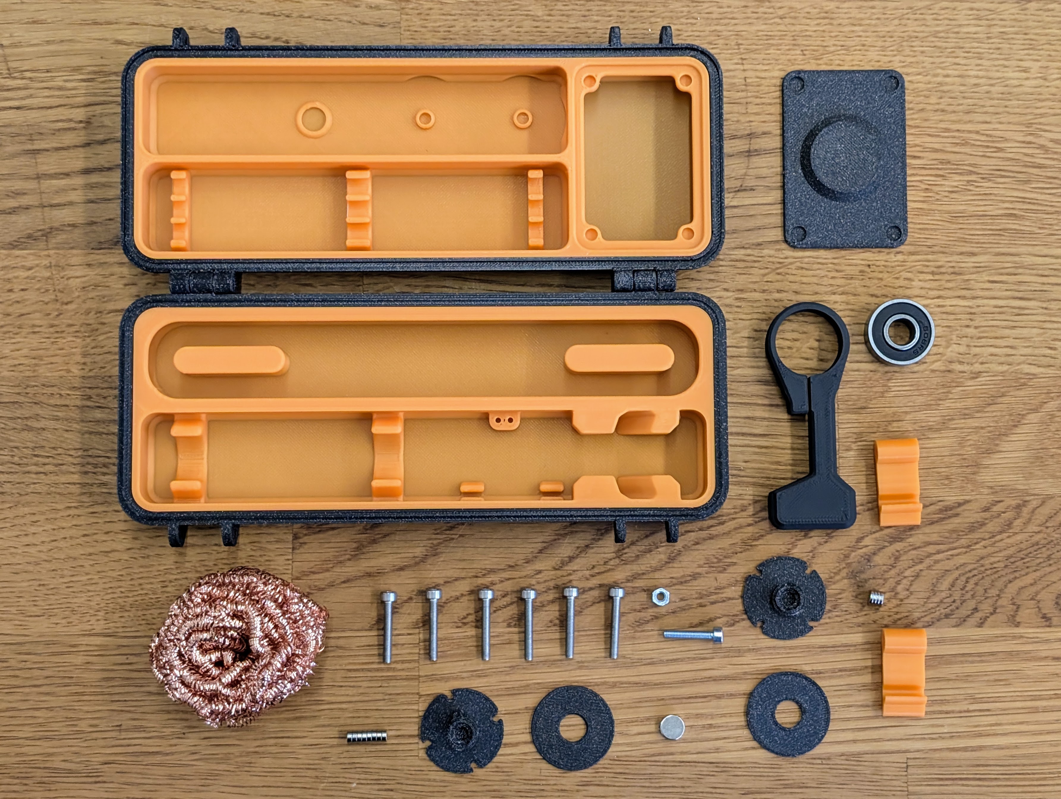 Pinecil case kit all individual parts Pinecil case kit: All individual parts of the kit lined up on a table