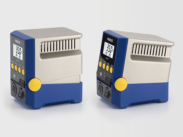 Two identical Hakko FX-971 soldering stations with silver-gray top and royal blue bottom