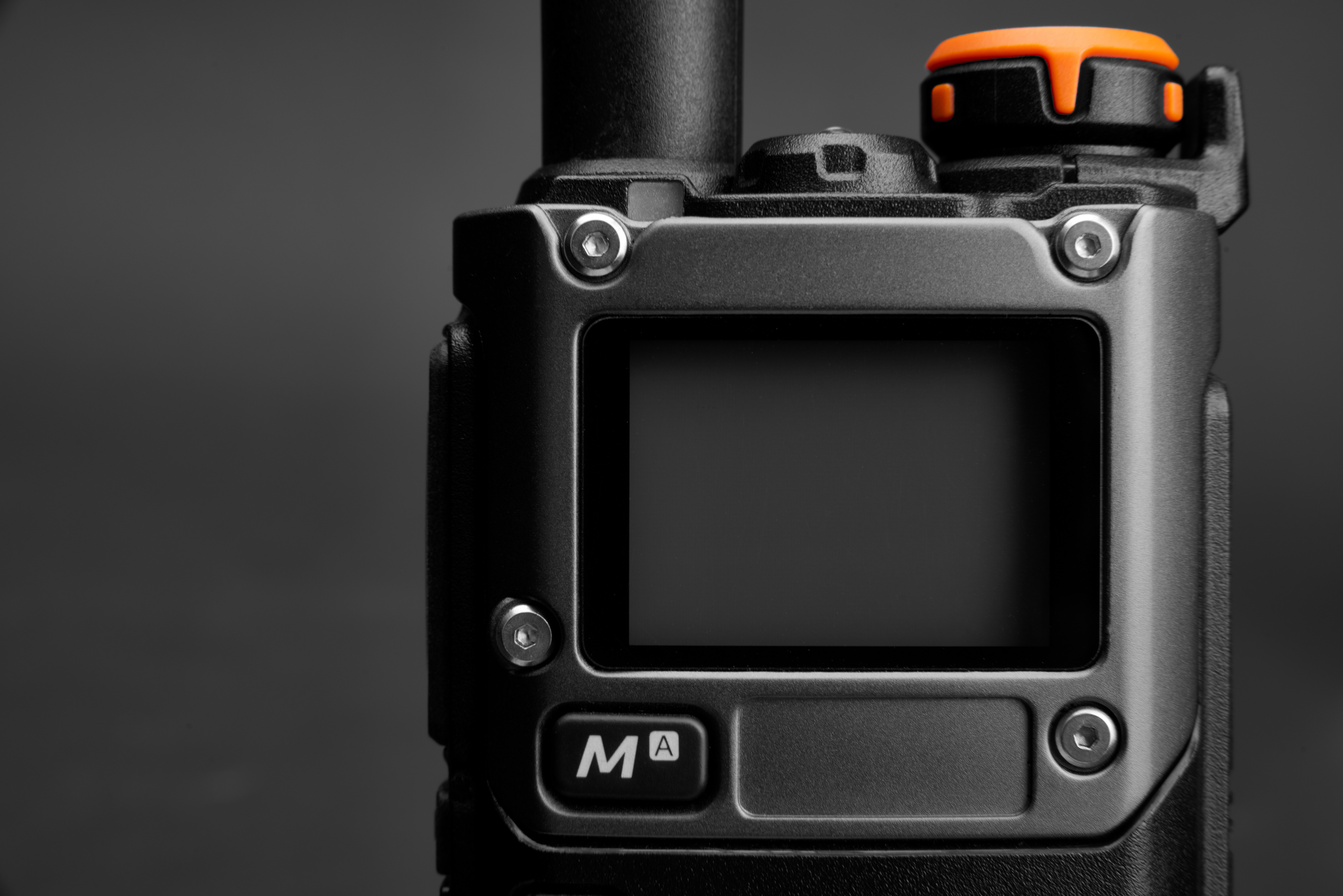 Close-up of the display on a powered-off black radio